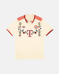 Bayern Munich hand-embroidered concept jersey front view — Bavarian folk botanical wreath in burgundy, blue and white on authentic 2024/25 cream white base — VOLTA Bavarian Folk Edition