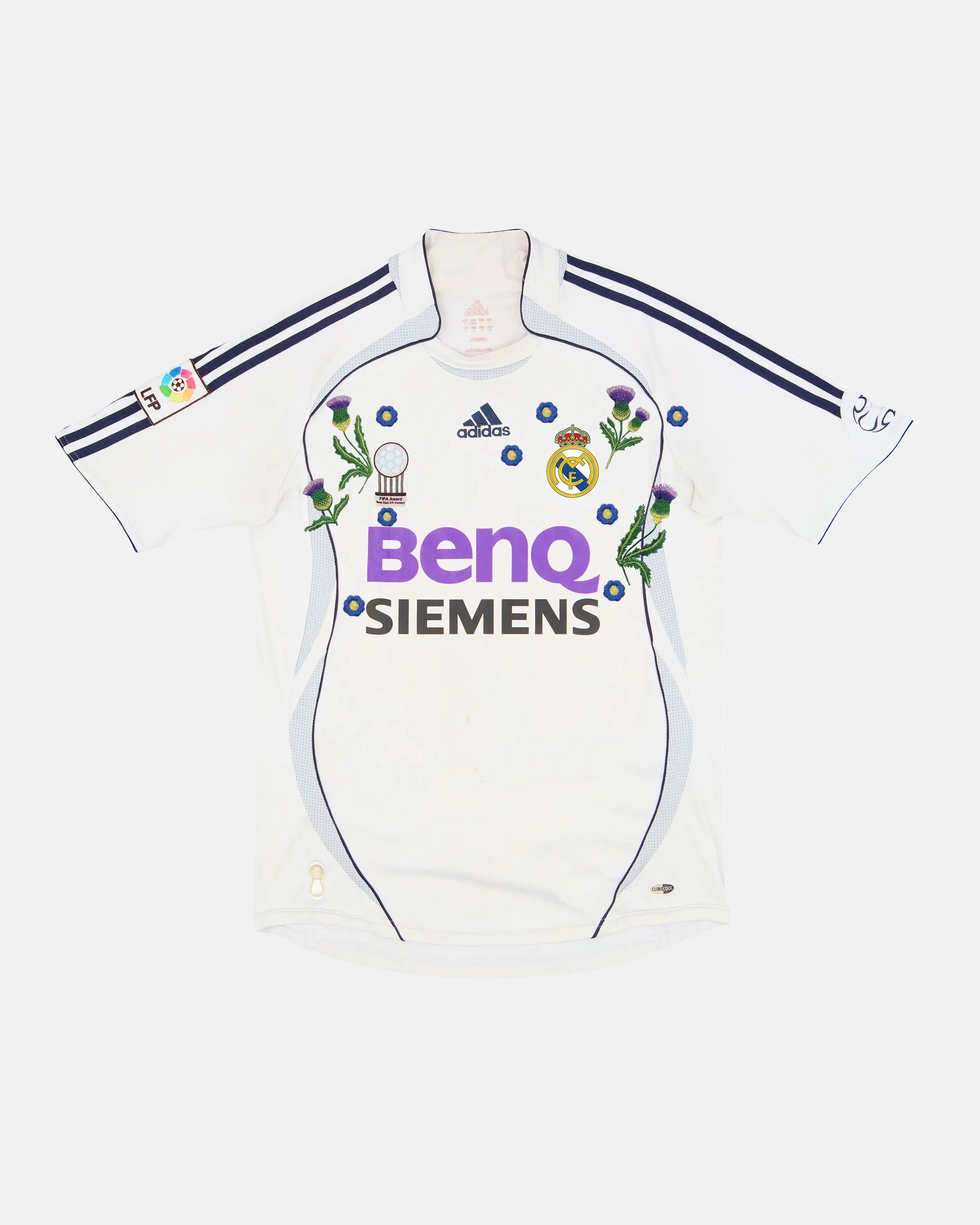 Real Madrid hand-embroidered retro concept jersey front view — Scottish thistle and blue forget-me-not botanical art on authentic 2006/07 white base — VOLTA Galáctico Garden Edition