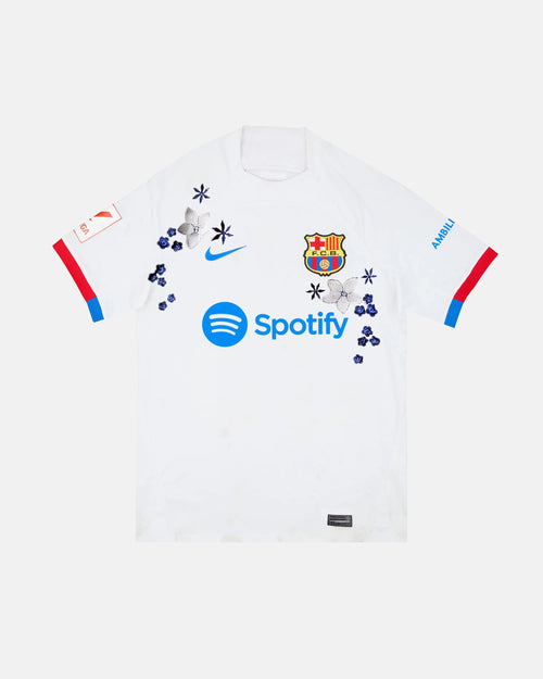 Full Front View Of The Bespoke Barcelona Embroidered Jersey (Azulejo White Edition), Showcasing The White Base Decorated With Hand-Stitched Silver Lilies and Cobalt Flowers.