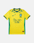 Brazil hand-embroidered World Cup 2026 concept jersey front view — botanical floral collar wreath and faith inscription on authentic Canarinha yellow base — VOLTA Canarinha in Bloom Edition