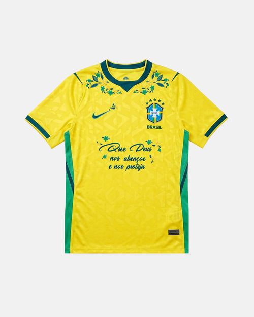 Brazil hand-embroidered World Cup 2026 concept jersey front view — botanical floral collar wreath and faith inscription on authentic Canarinha yellow base — VOLTA Canarinha in Bloom Edition