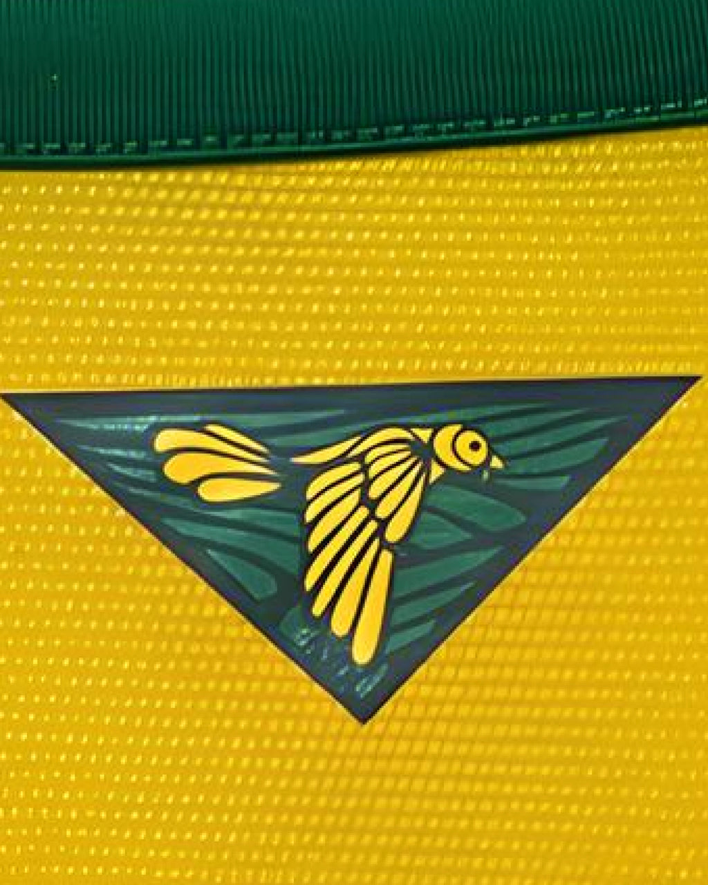 Close-Up Macro Detail Of The Yellow Fabric Mesh On the Brazil Jersey 2014 Revisited Highlighting The Inner Neck Canary Graphic and Green Collar Seam.