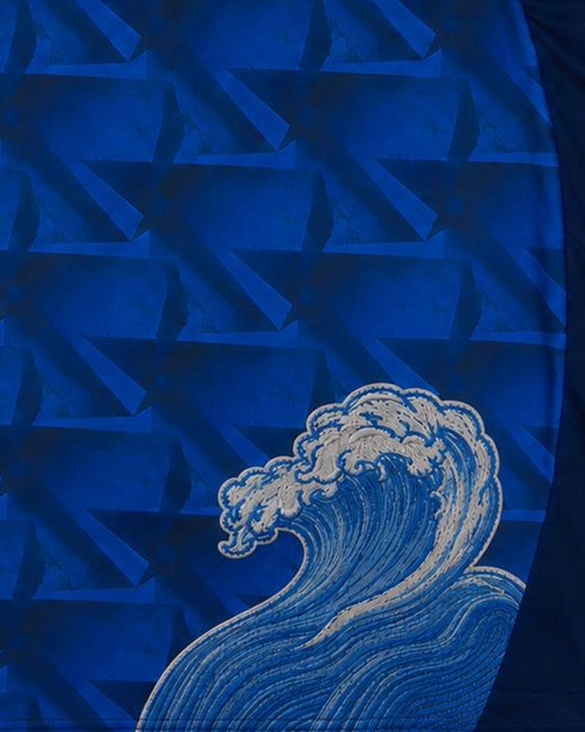 Close-up of geometric triangle all-over print textile base — Cape Verde 'Blue Shark' Edition — VOLTA Paris