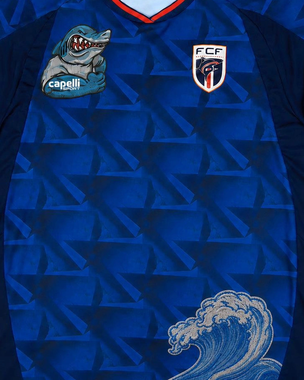 Close-up of hand-embroidered blue shark mascot patch — Cape Verde 'Blue Shark' Edition — VOLTA Paris