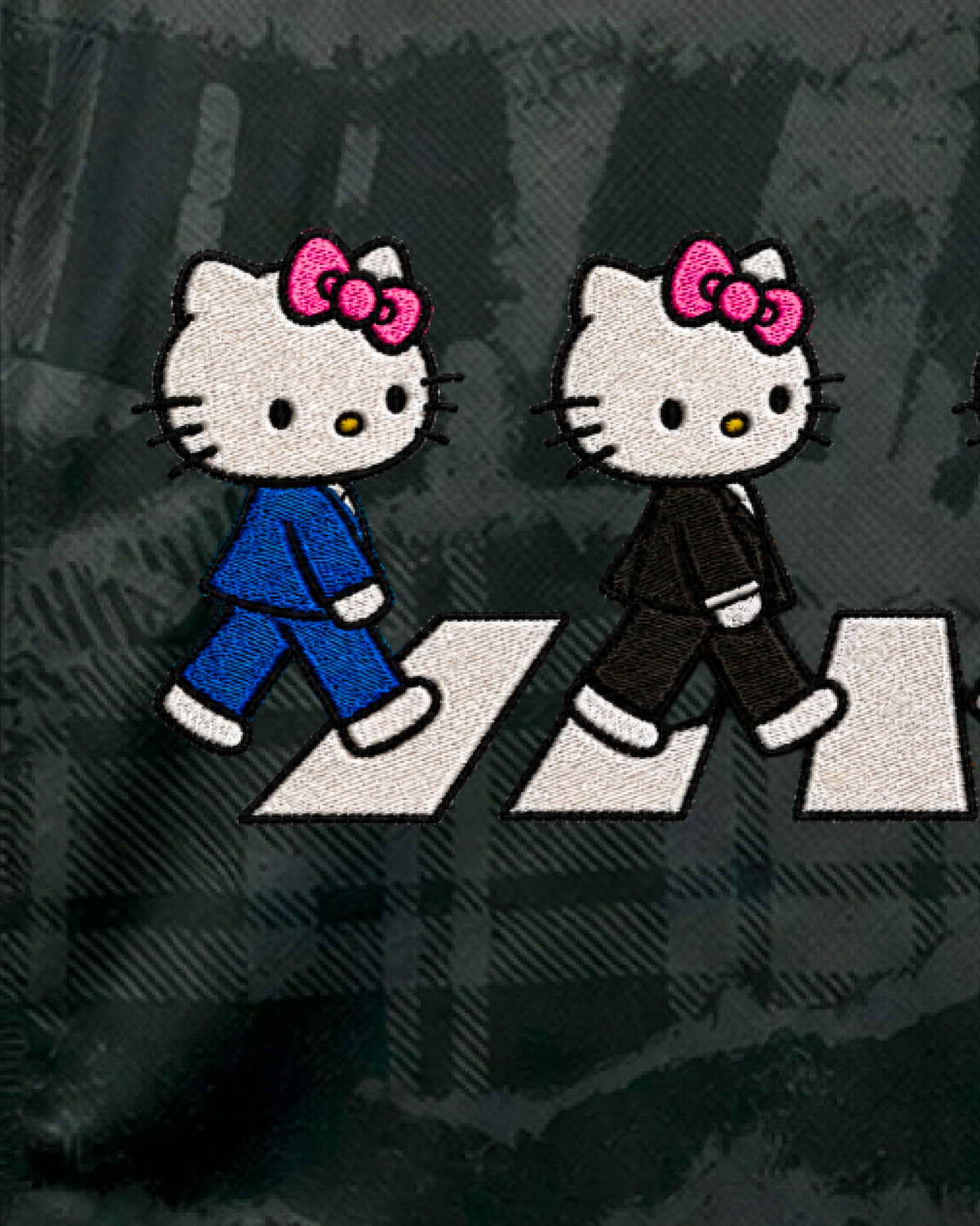Close-up of hand-embroidered blue-suit and black-suit cat characters — Chelsea ‘Abbey Cats’ Edition — VOLTA Paris