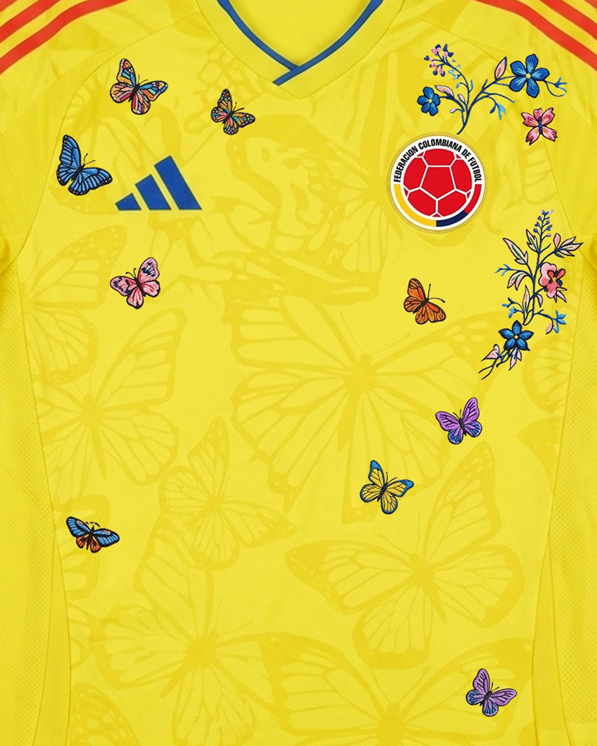 Close-up of hand-embroidered butterfly and botanical flower motifs on Colombia 'Mariposa' Edition jersey — VOLTA Paris