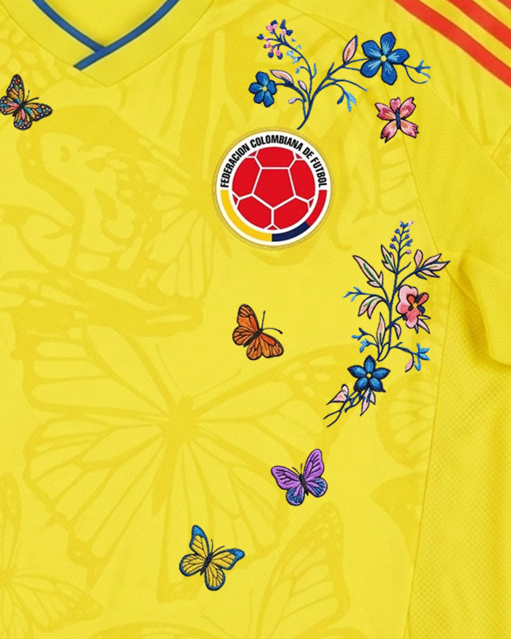 Hand-embroidered blue morpho butterfly detail on Colombia 'Mariposa' Edition jersey — VOLTA Paris