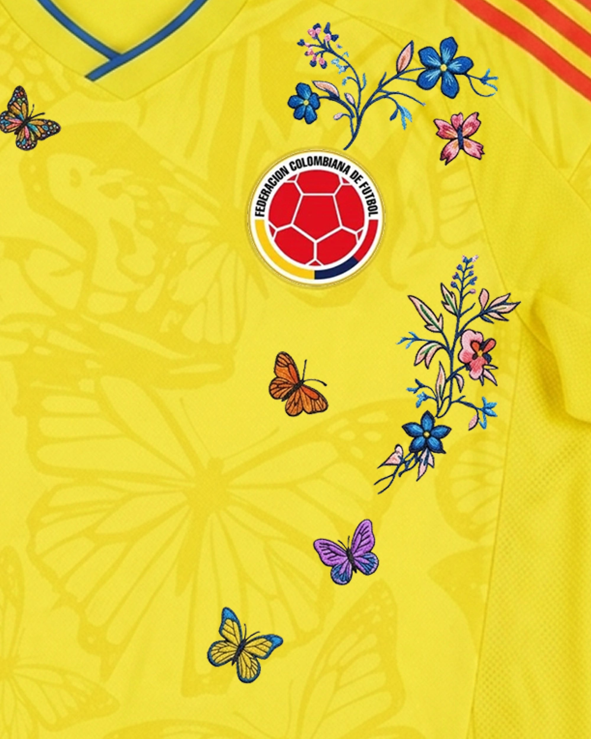 Hand-embroidered blue morpho butterfly detail on Colombia 'Mariposa' Edition jersey — VOLTA Paris