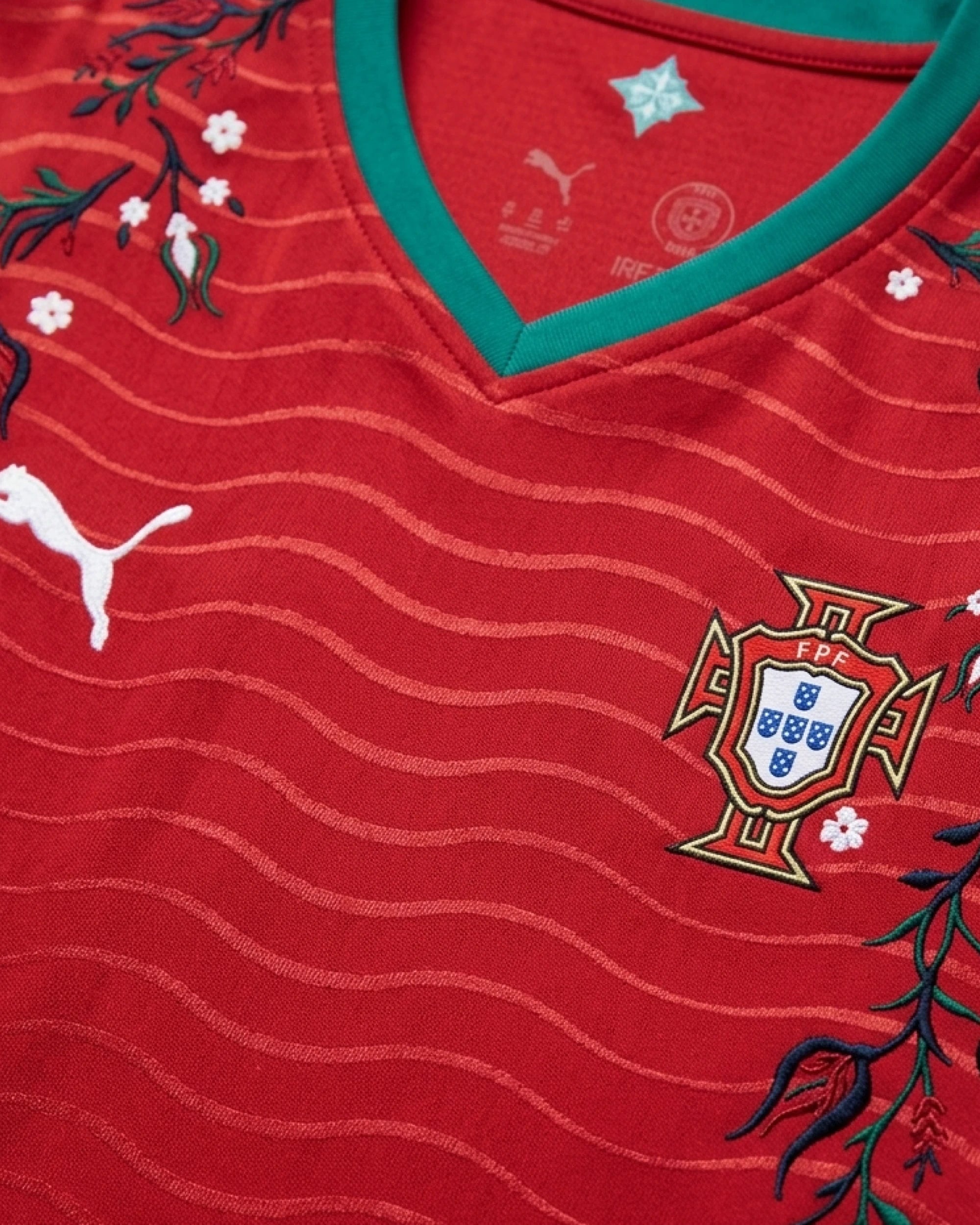 Close-Up Macro Focus On The Left Chest Of The Custom Portugal Home Kit, Highlighting The Traditional Team Shield Crest Wrapped In High-Density Blue And White Embroidery.