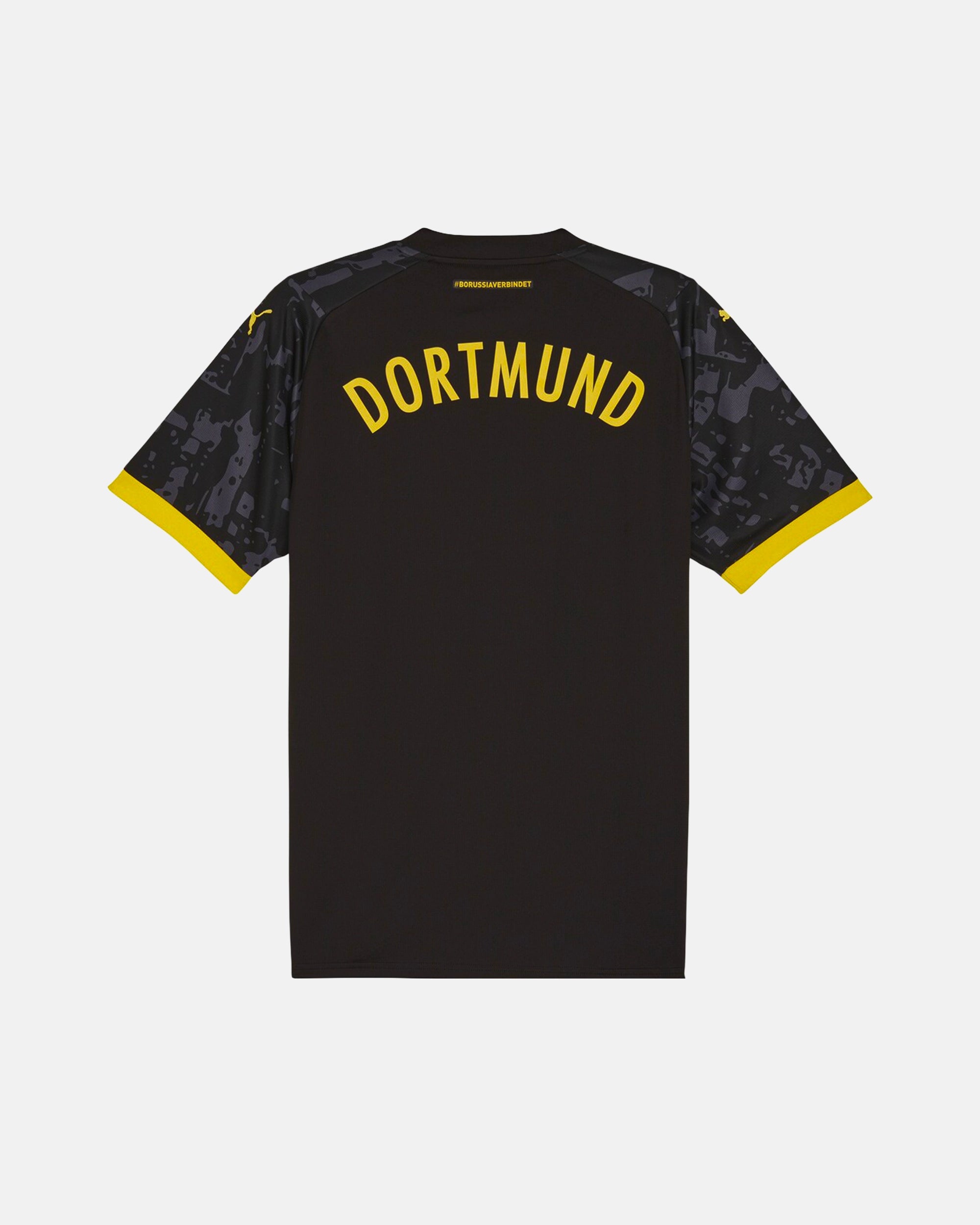 Full Back View Of The Dortmund Special Edition Jersey Reimagined Base, Highlighting The Stealth Charcoal Back, Yellow Dortmund Typography, And Yellow Cuffs.