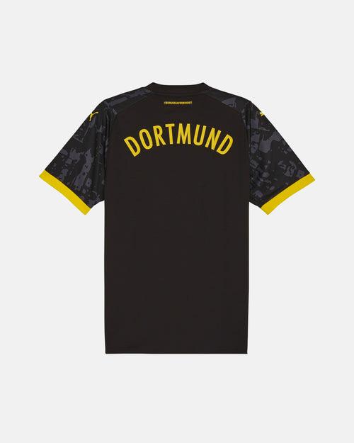 Full Back View Of The Dortmund Special Edition Jersey Reimagined Base, Highlighting The Stealth Charcoal Back, Yellow Dortmund Typography, And Yellow Cuffs.