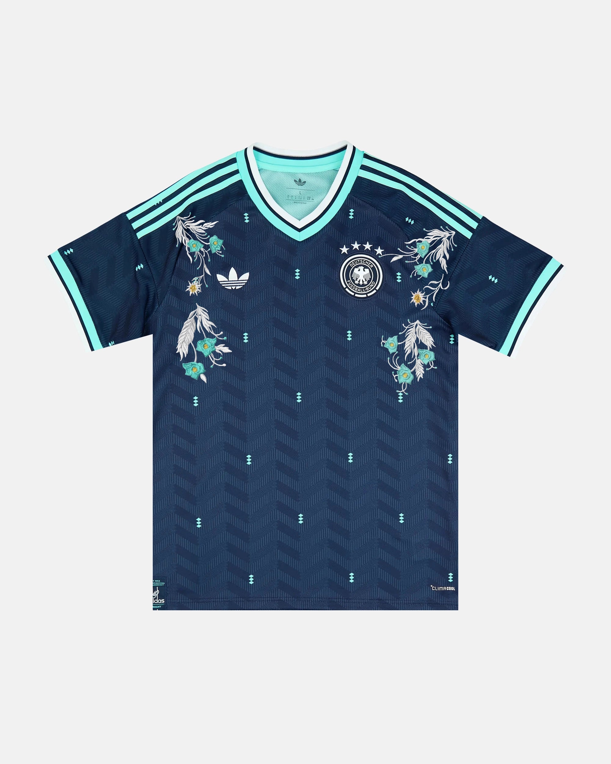 Full Front View Of The Bespoke Germany World Cup 2026 Jersey Reimagined, Showcasing The Navy Chevron Base, Mint Cuffs, and Silver Alpine Edelweiss Embroidery.