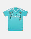 Full front view of the Inter Miami Blue Jersey Reimagined (Ocean Drive Edition), showcasing the ocean blue base decorated with hand-embroidered pink hibiscus flowers.
