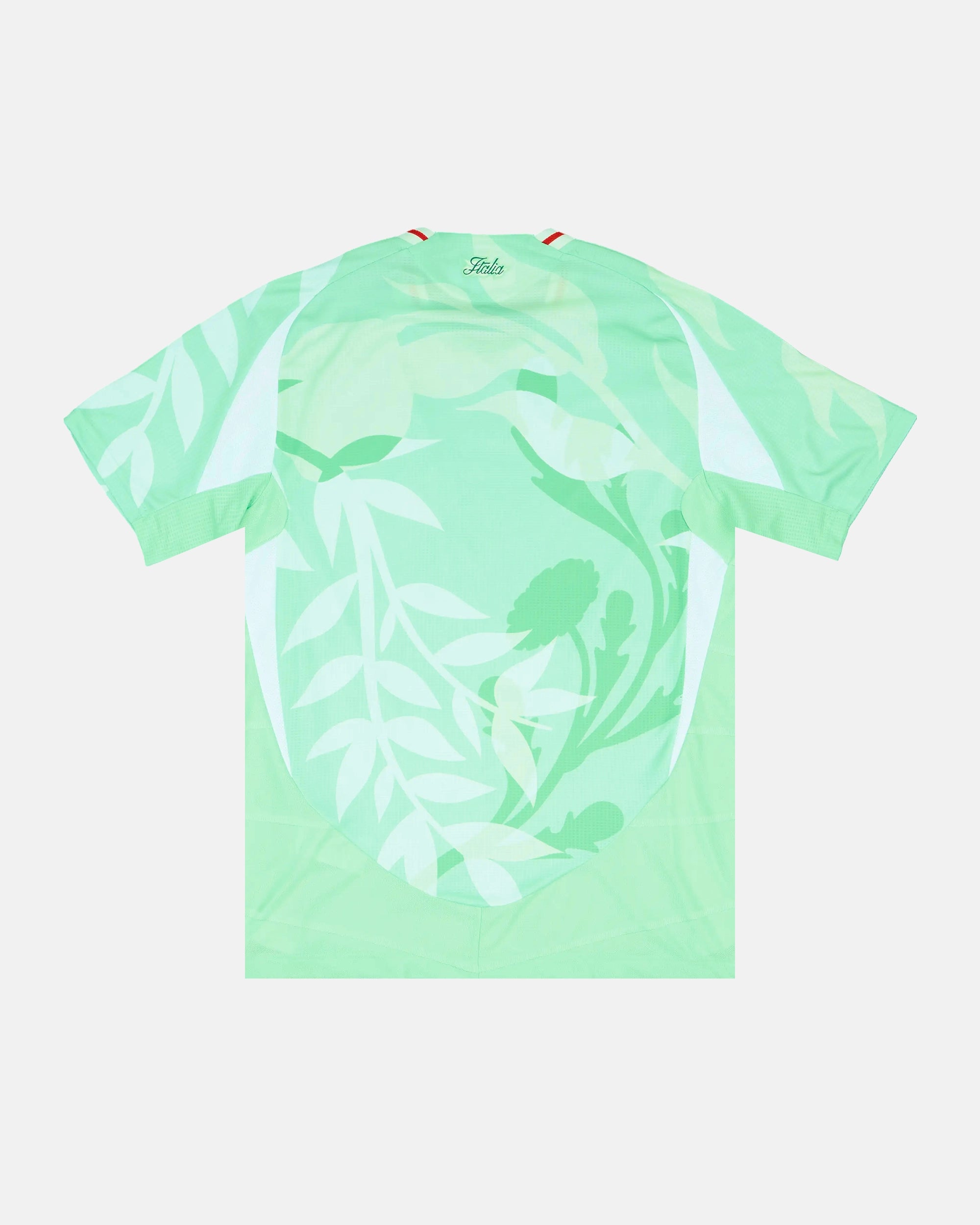 Full Back View Of The Italy World Cup Jersey Reimagined Base, Highlighting The Sublimated Leaf Graphics And Elegant Cursive Italia Neck Typography.
