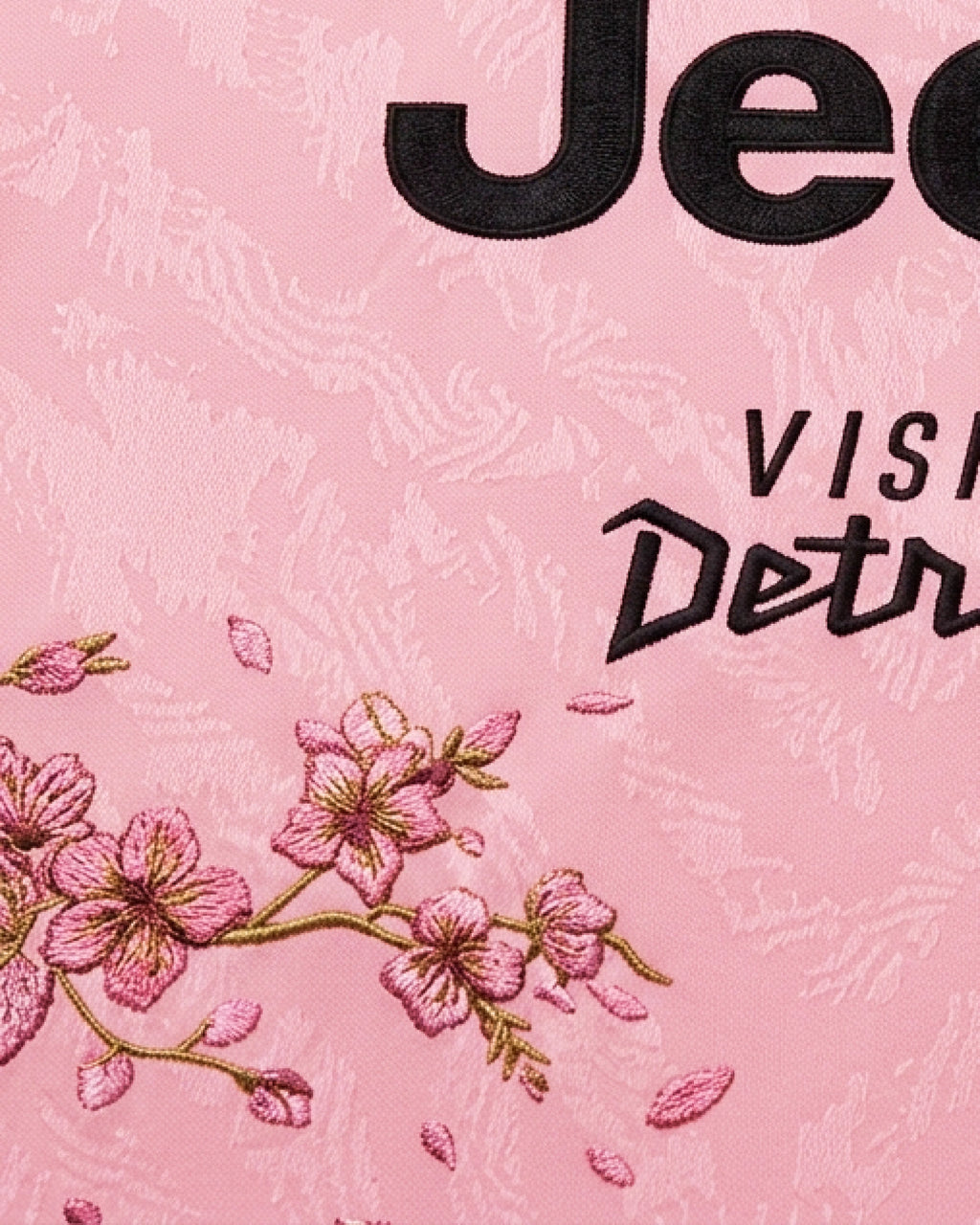 Hand-embroidered lower blossom branch with falling petals scattered across pink base — Juventus 'Savoy Garden' Edition — VOLTA Paris