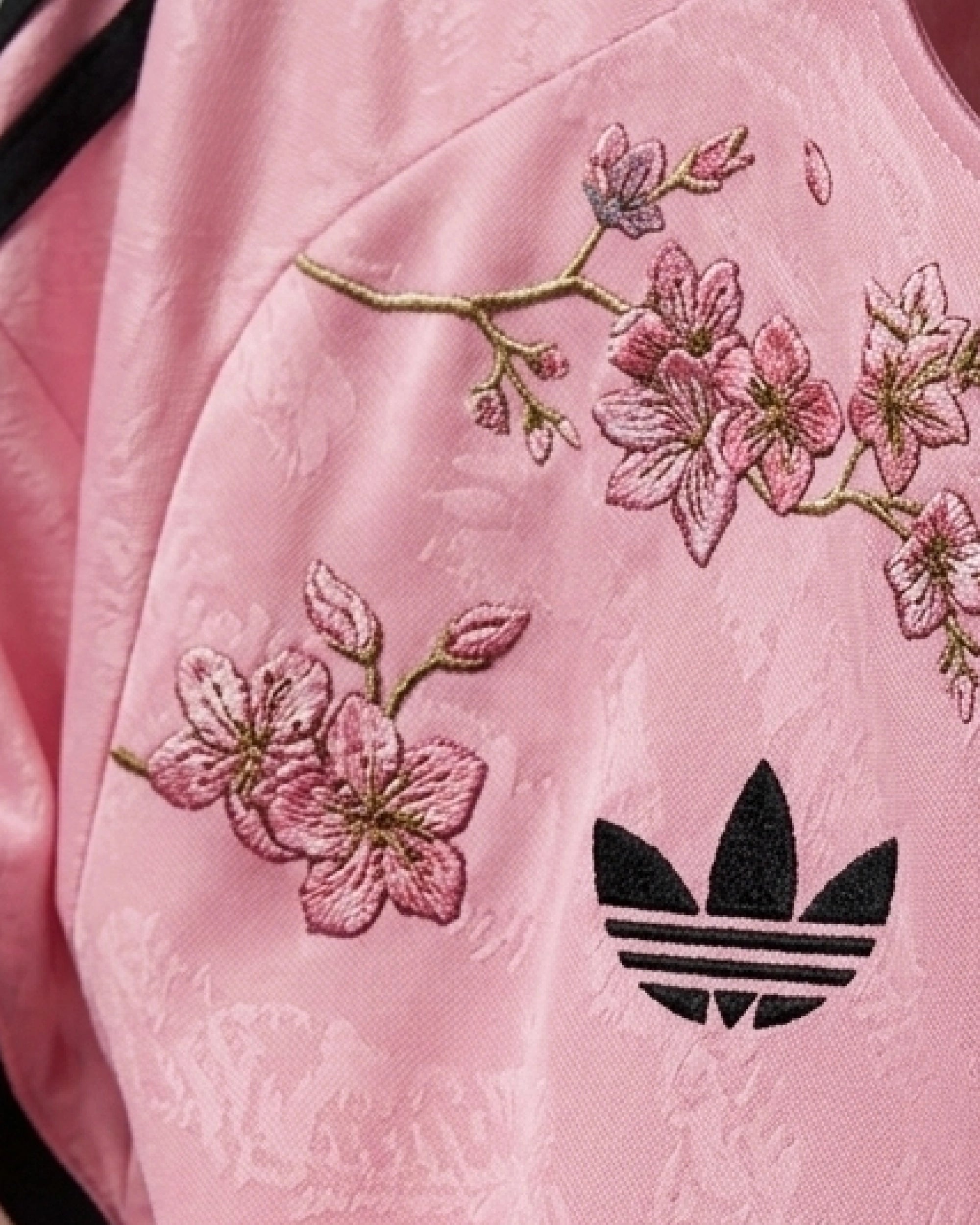 Detailed view of hand-embroidered upper blossom branch with gold stem and open flowers — Juventus 'Savoy Garden' Edition — VOLTA Paris