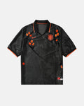 Netherlands hand-embroidered concept jersey front view — orange tulip botanical art on authentic black crinkle jacquard base with KNVB lion crest — VOLTA Black Tulip Edition