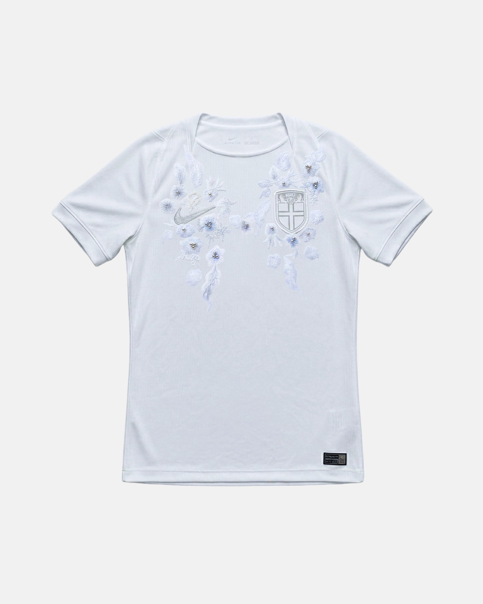 Full front view of the bespoke Norway 'Frozen' Edition Norway Concept Jersey, featuring intricate icy-blue floral botanical art and 3D pearls hand-stitched across the chest of the Norway White Jersey base.