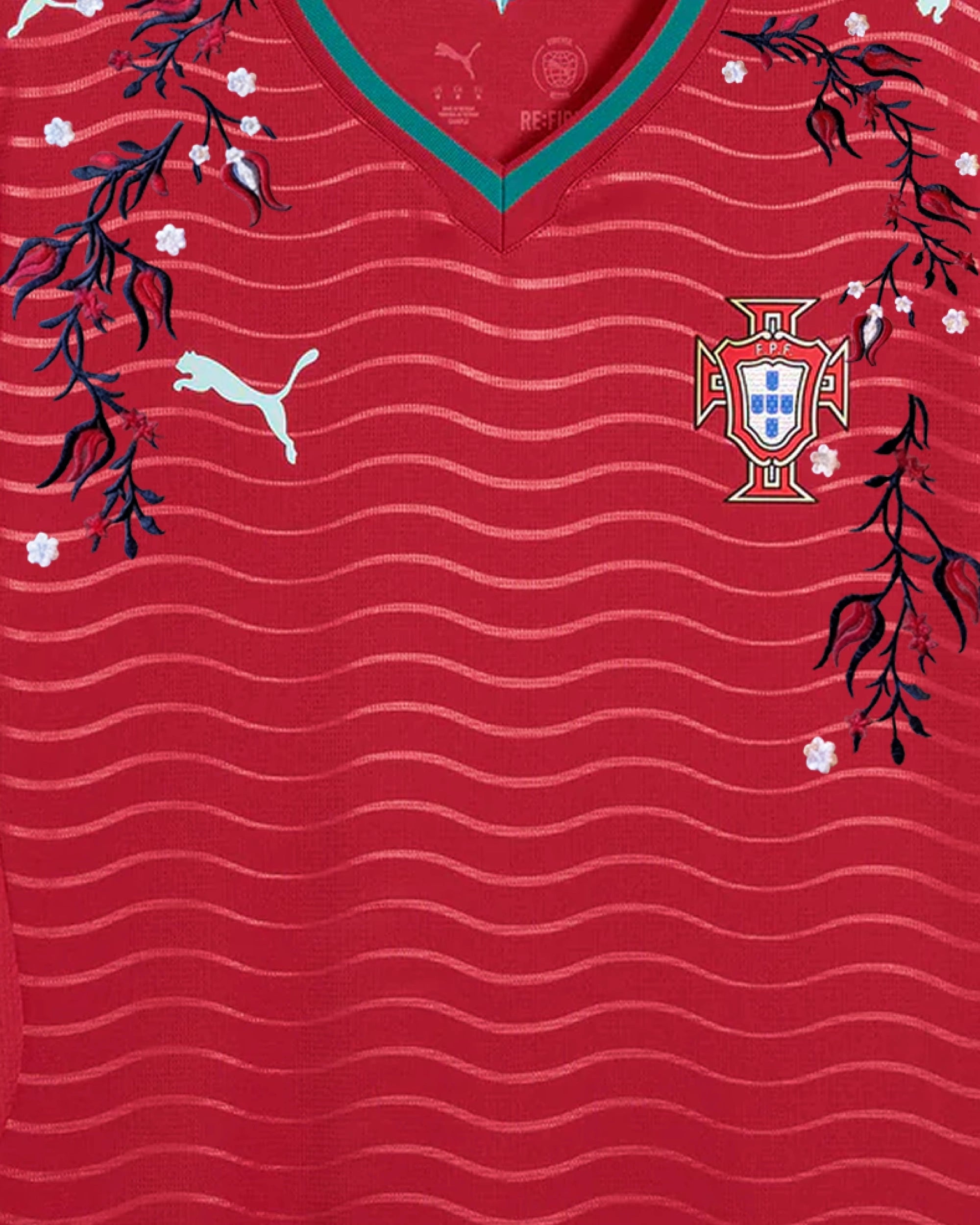 Upper Torso Detail Shot Of The Portugal World Cup Jersey Reimagined, Displaying The Asymmetrical Dark Blue Vines And White Flowers Encasing The Crest And Brand Logo.