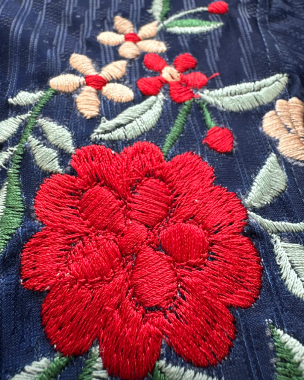 Botanical embroidery close-up — PSG custom jersey handcrafted in Versailles and Paris — VOLTA