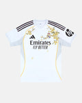 Full Front View Of The Bespoke Real Madrid Embroidered Jersey (Alba Blossom Edition), Showcasing The White Base Decorated With Hand-Stitched Golden Orange Blossoms and Floating Petals.