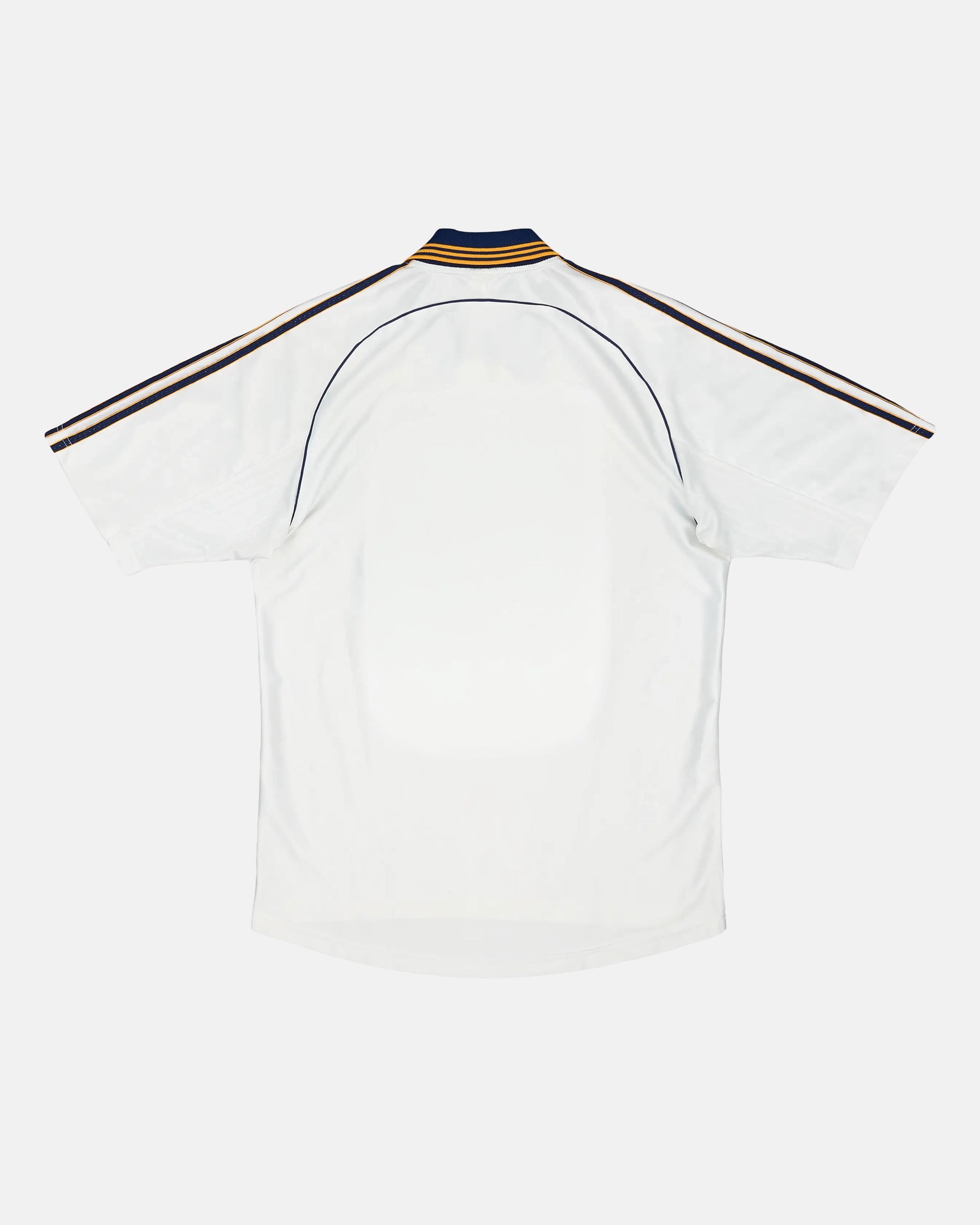 Full Back View Of The Real Madrid Concept Jersey Base, Highlighting The Clean Vintage White Mesh, Curved Dark Piping, And Striped Rear Polo Collar.