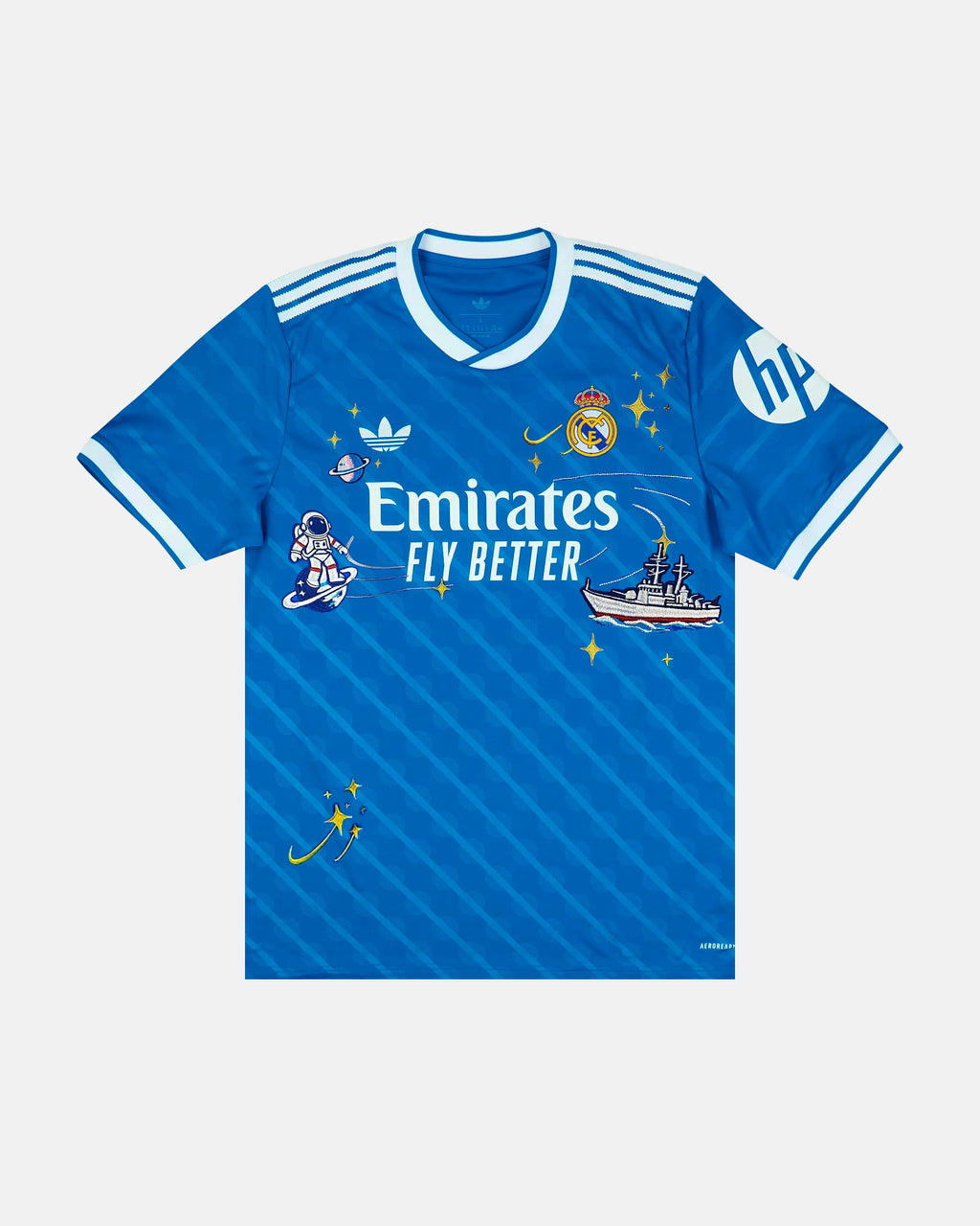 Full Front View Of The Bespoke Real Madrid Embroidered Jersey (Space Race Edition), Showcasing The Blue Diagonal-Striped Base Decorated With Hand-Stitched Astronaut and Warship Art.