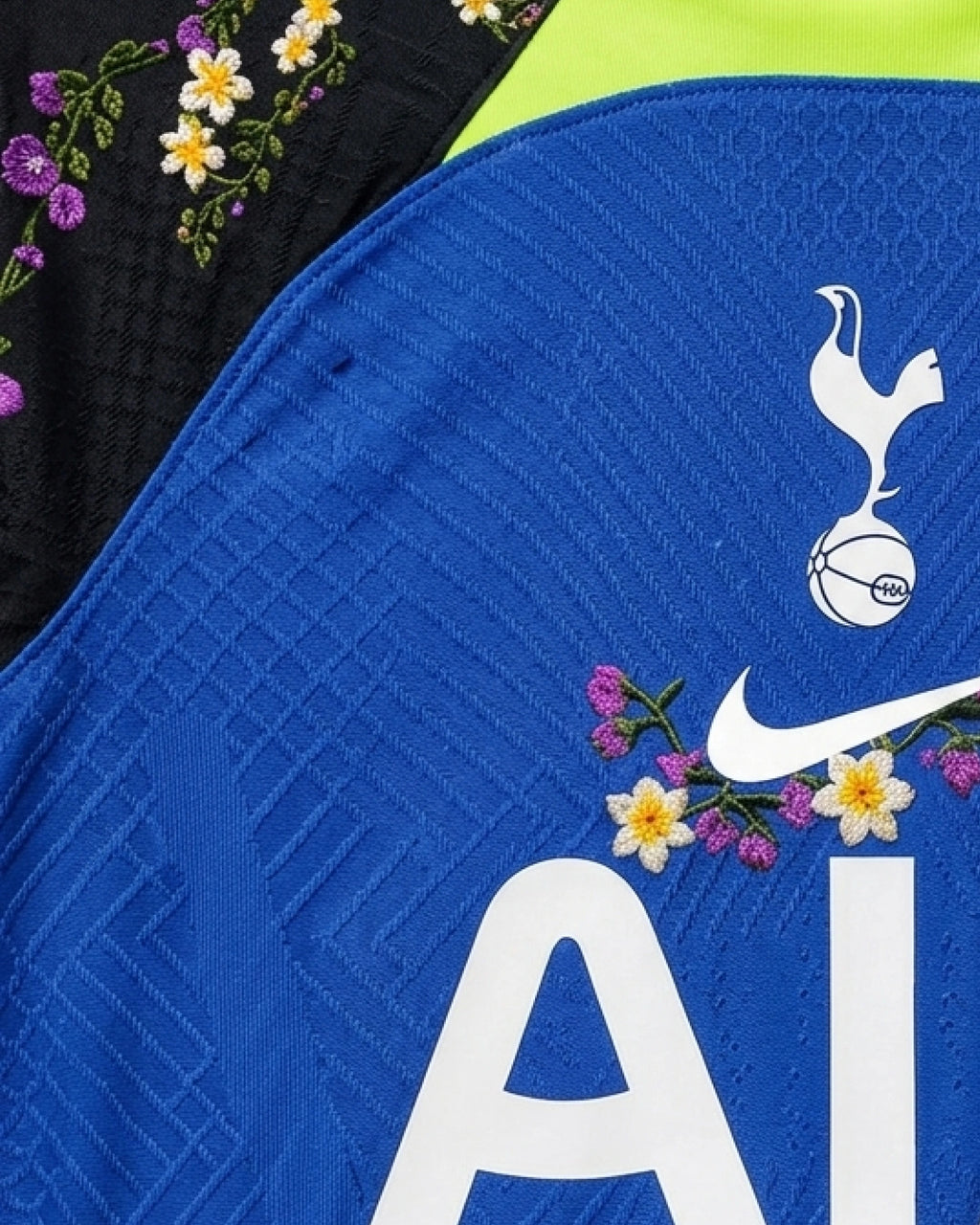 Detailed view of hand-embroidered wildflower garland on Tottenham 'Seven Sisters' Edition jersey sleeve — VOLTA Paris